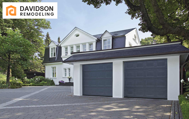 Exterior view of a stylish entryway created from a converted garage door, featuring modern design elements and a welcoming pathway.